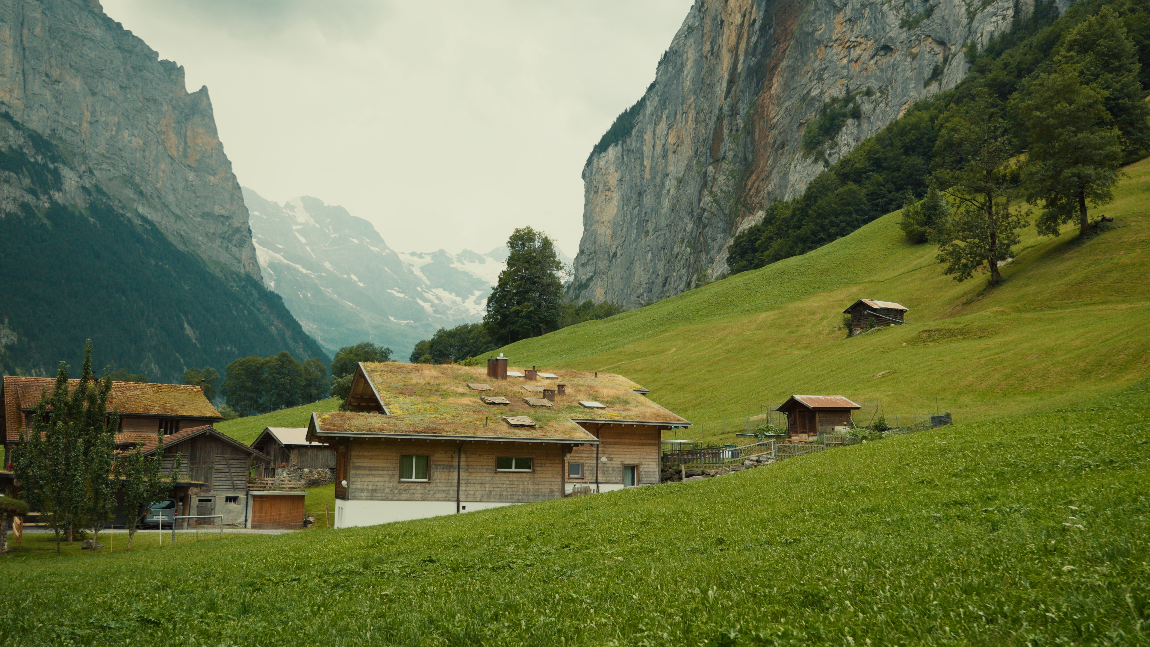 Stylized Swiss valley with cliffs and waterfall