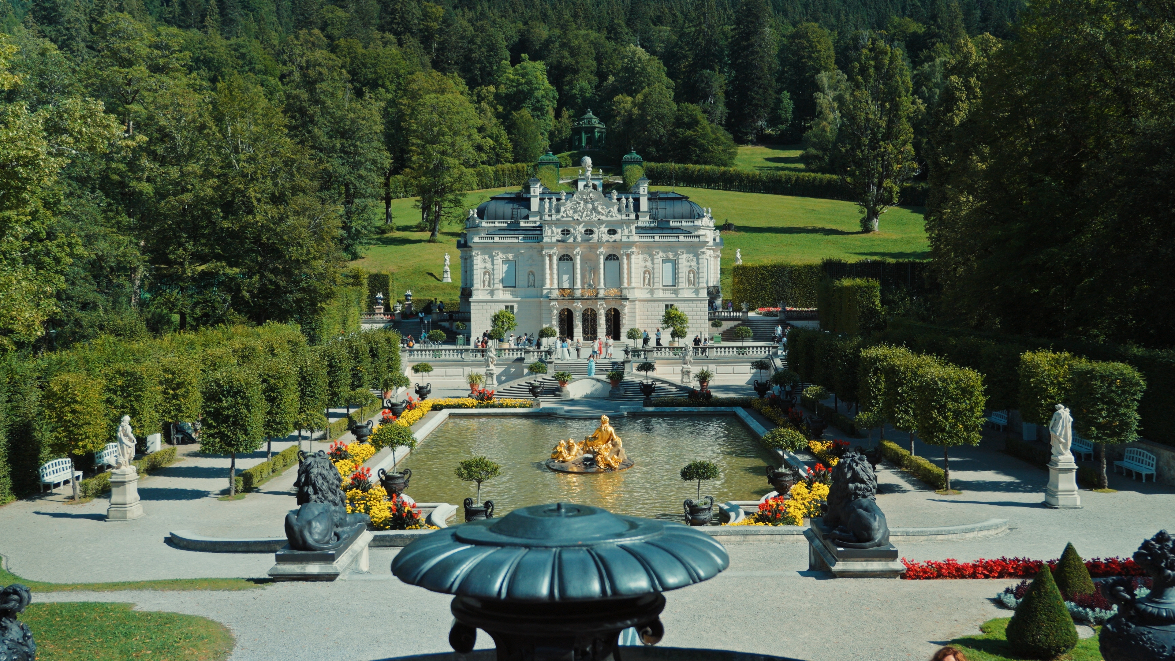 Linderhof Palace surrounded by gardens and Alpine scenery